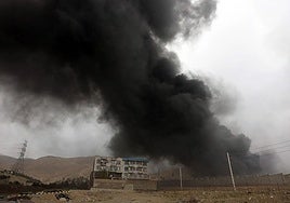 Smoke rises from an oil depot near Tehran.