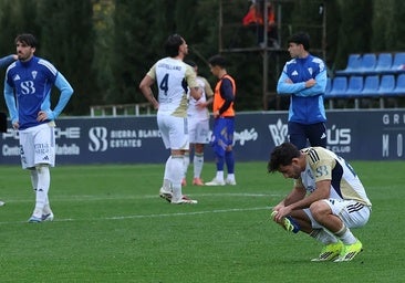 The Marbella players at the full-time whistle.