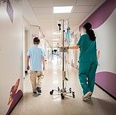 A nurse accompanies a child in the paediatric oncology ward of Hospital Materno in Malaga.