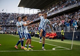Adrián Niño celebrates restoring Malaga's lead just before half time.