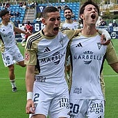 Jorge Álvarez and José Cambra celebrate Marbella's second goal against Sevilla Atlético.