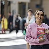 Paula Orell posing with her book.