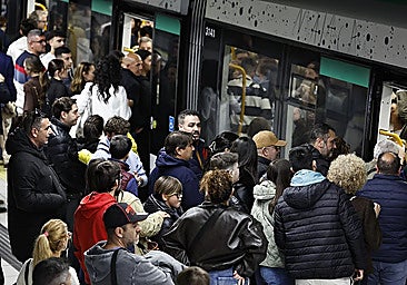 Passengers waiting to board a Malaga metro train on Holy Monday.