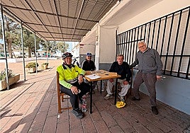 Some of the users playing dominoes outside the closed centre
