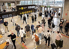 Passengers exiting Malaga Airport.