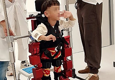 Four-year-old Alán Josué in Malaga with the exoskeleton that helps him walk.
