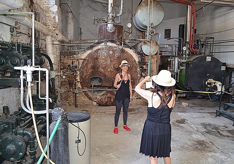 Visitors inside the sugar cane mill at a previous event.