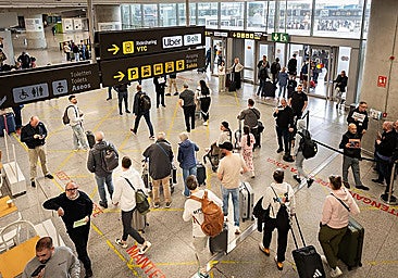 Passengers leaving the Arrivals area at Malaga Airport.