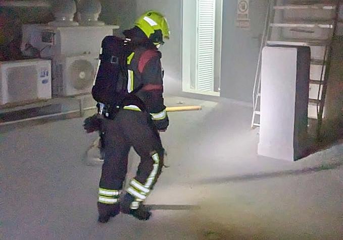 Firefighters working inside the hotel.