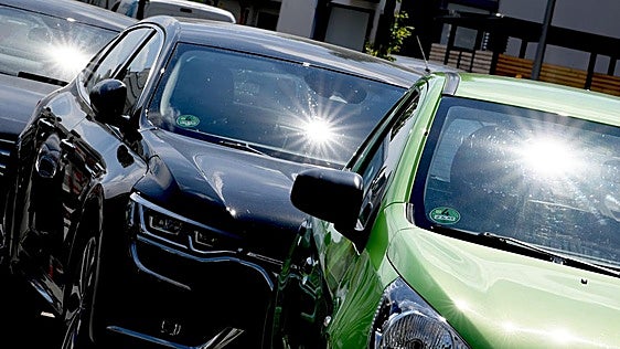 How do you respond if you see a child or animal in a hot car?