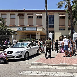 Parents waiting to pick up their children from the Santa Amalia school in Fuengirola.