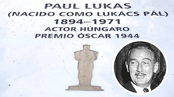 A close-up of the new headstone of Oscar-winning actor Paul Lukas, shown in the circular photograph.