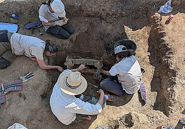 The team unearthing the chariot