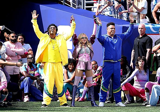 Madonna, centre, flanked by Ronaldinho and Ronaldo Nazário during the half-time show.