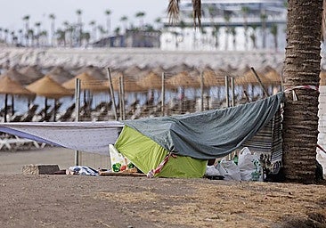 An impromptu campsite at the La Malagueta beach in Malaga.