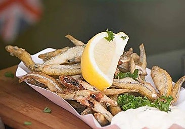 Fried anchovies (boquerones) with lemon.