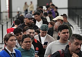 Foreign nationals queuing for the special regularisation process in Spain.