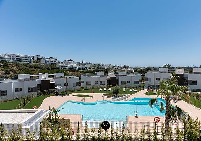 The communal pool at the Santa Clara development in Marbella forms part of the wider setting of the apartment. Pool and landscaping are not presented as Miccoli Interiors design work.