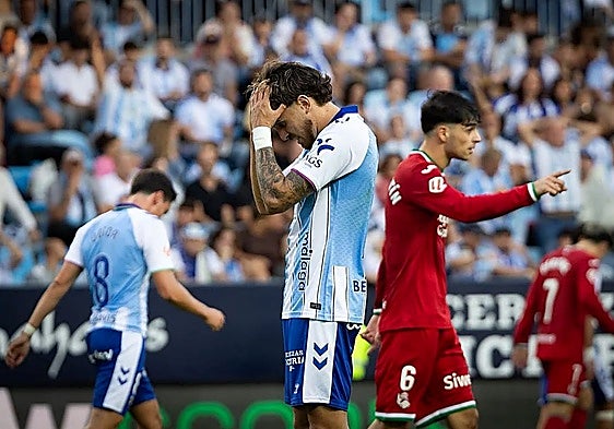 Left-back José Salinas despairs during Sunday's thrashing.