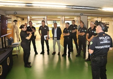 The councillor for Public Safety is told about the new training system alongside Local Police officers.
