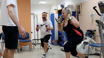 Two of the patients are doing strength training exercises in the Cardiac Rehabilitation Unit.