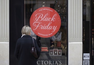 A shop window in Malaga displaying last year's Black Friday adverts.