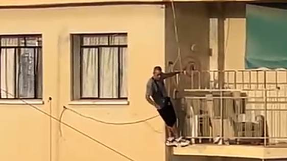 Malaga gender-based violence suspect hangs from fifth-floor balcony for over four hours threatening to jump