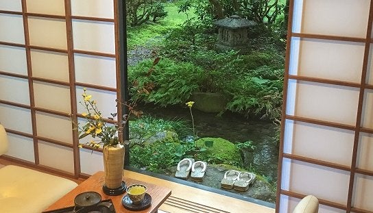 The view of the courtyard garden from a traditional ryokan bedroom.