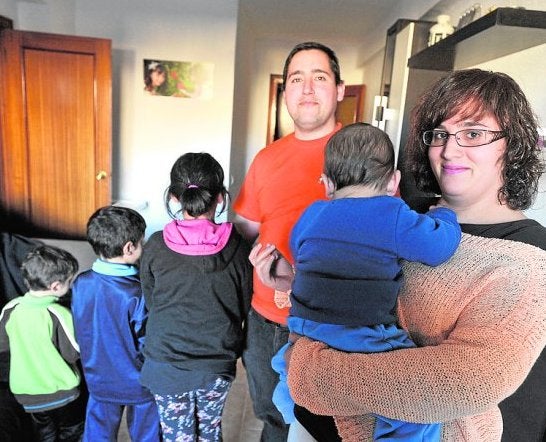 Ismael and Susana with their four children in their family home.