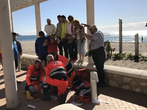 Tense moments on Fuengirola seafront as paramedics work to save the man.