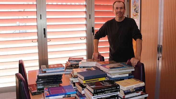 John with the donated books.