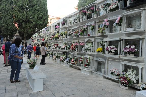 All Saints' Day. Hundreds of people lay flowers at the graves of their loved ones.