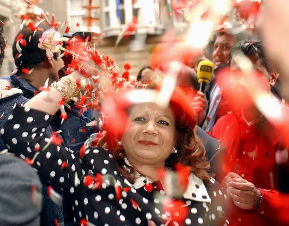 A gypsy throws rose petals at Cristo de los Gitanos in Granada.