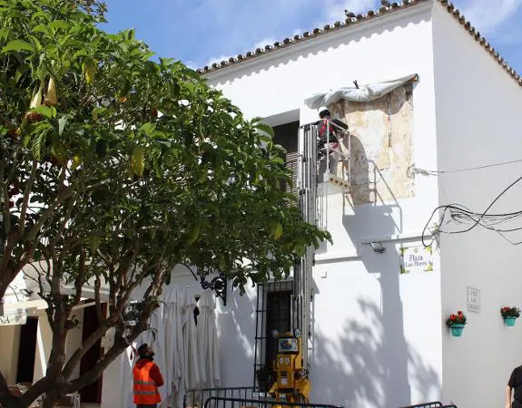The mural on the front of a house in the Plaza de Las Flores is now being restored.