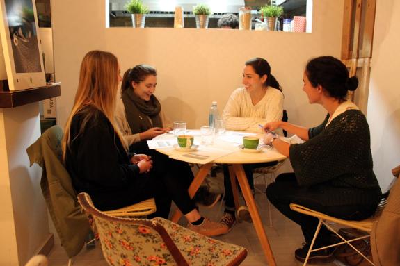 An upper intermediate Spanishcafé group taught by Clara Anuncio (right).