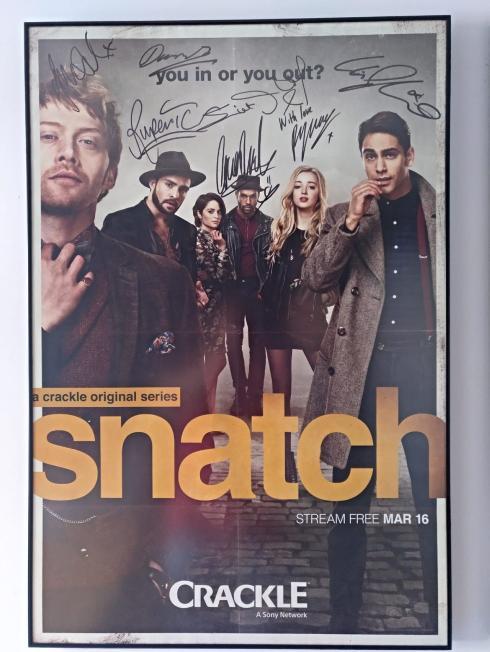 The Snatch poster, signed by the actors in the series.