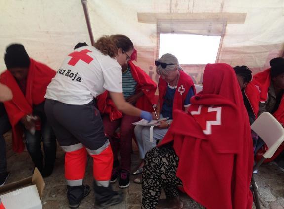 Members of the Red Cross at work in Malaga on Monday.