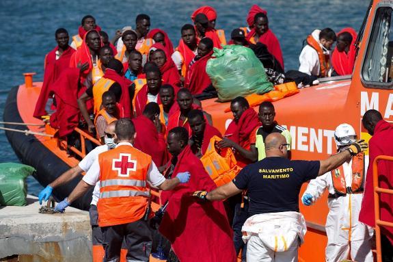 Migrants rescued at sea arrive in Malaga port.