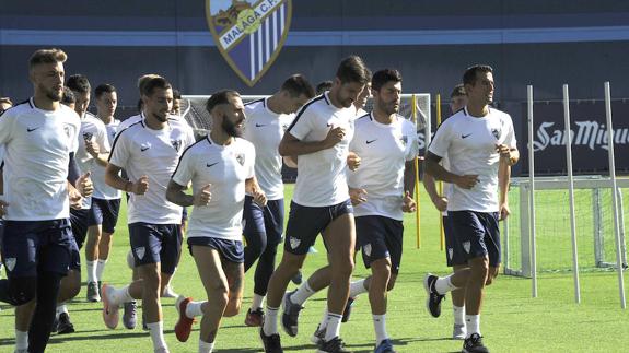 The players back on the pitch at La Rosaleda on Monday.