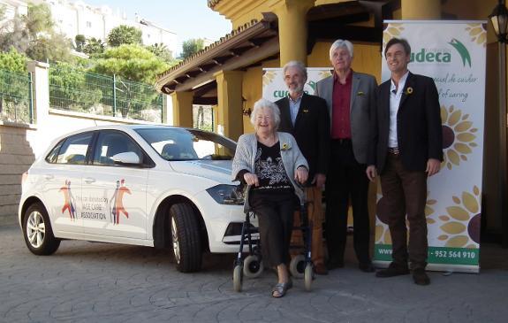 Joan Hunt accepts the car from Age Care Association.