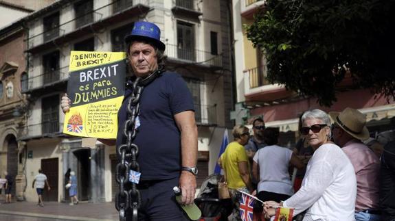One of the protesters makes his point in Malaga on Sunday.