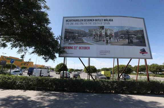 A sign informs the public of the planned opening day.