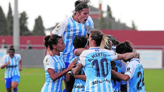 Malaga celebrate their equaliser on Sunday.