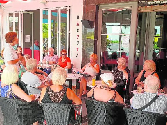 Carers listen to advice given by nurse Fay Newman during the Lions support group meeting in Mijas.