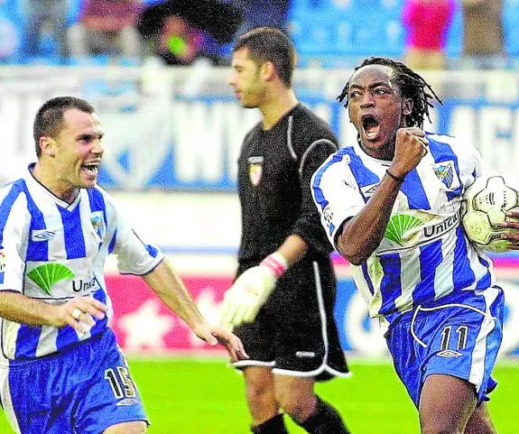 Musampa, right, celebrates a goal with teammate Gerardo in 2001. 