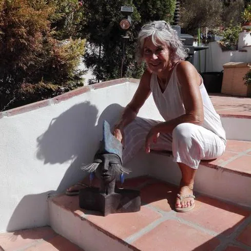 Anne-Barbara Lenzin with one of her iconic ceramic clay heads at her house near Cajiz. 