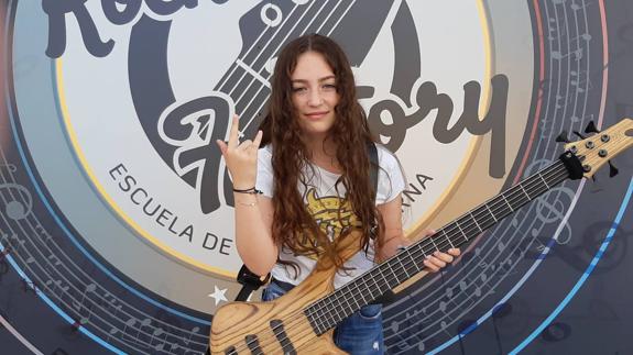 Blanca, with her electric bass, outside Rock Factory.