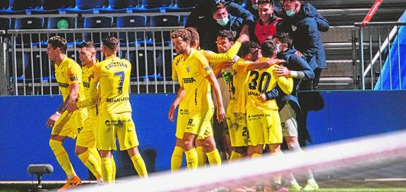 The Malaga players celebrate Ramón's late goal which ensured the win in Fuenlabrada with five minutes to go on Tuesday night. 