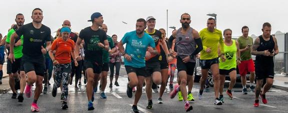 Runners taking part in the charity relay event .