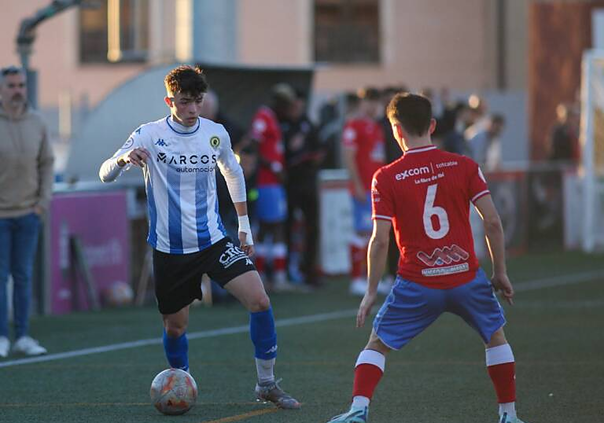 David López durante un encuentro con el filial.